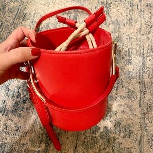 Red leather bucket bag with handle or strap